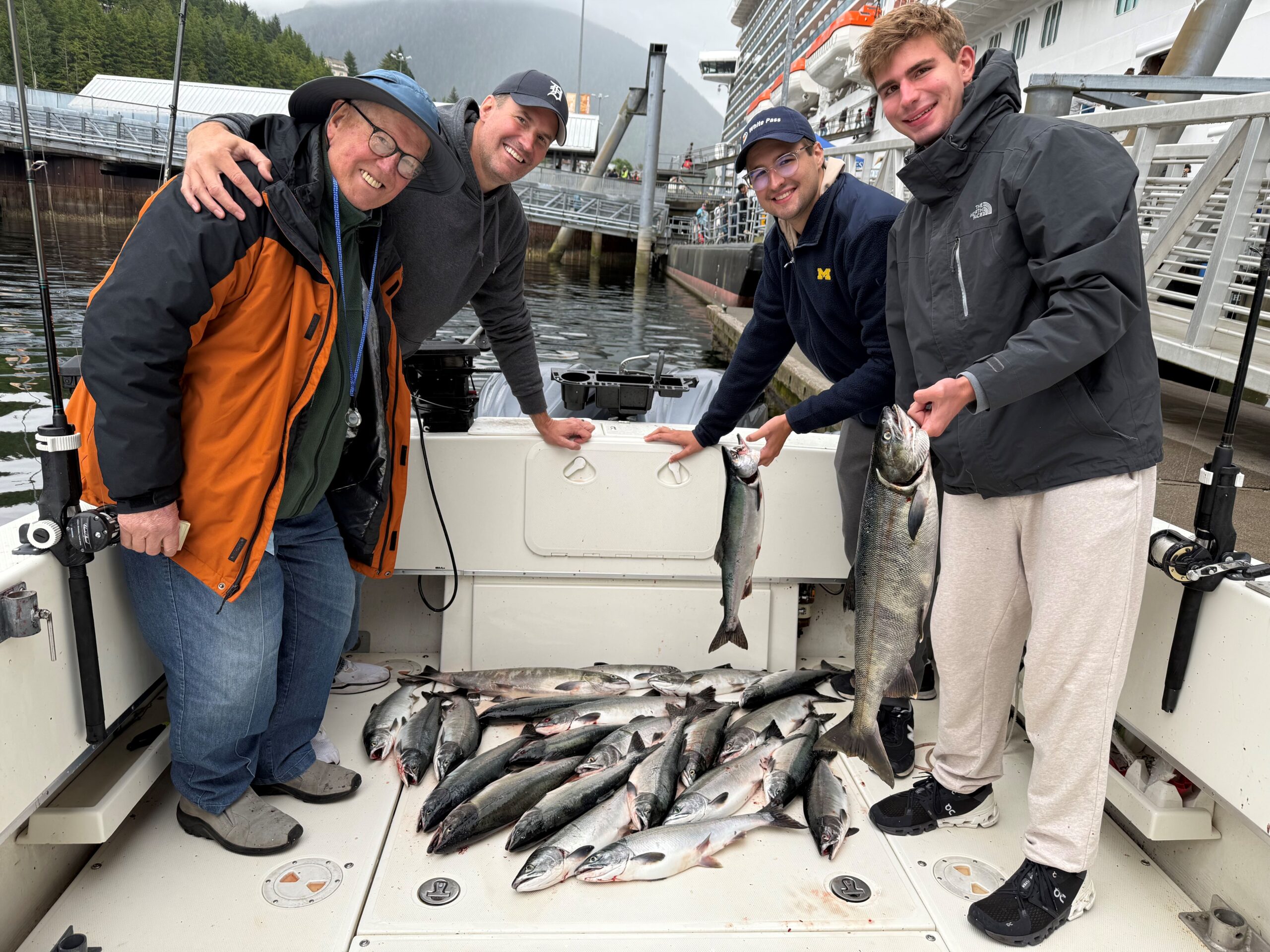 Happy cruise ship passengers showing off bright Salmon caught on a 4-hour Ketchikan fishing charter with Campbell’s Fishing Charters on the 4 C’s.