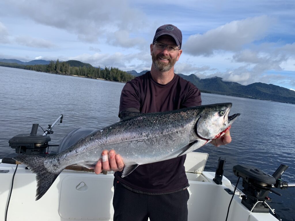 Ketchikan fishing report October photo of a happy fisherman holding a beautiful Winter King Salmon on the 4 C's.