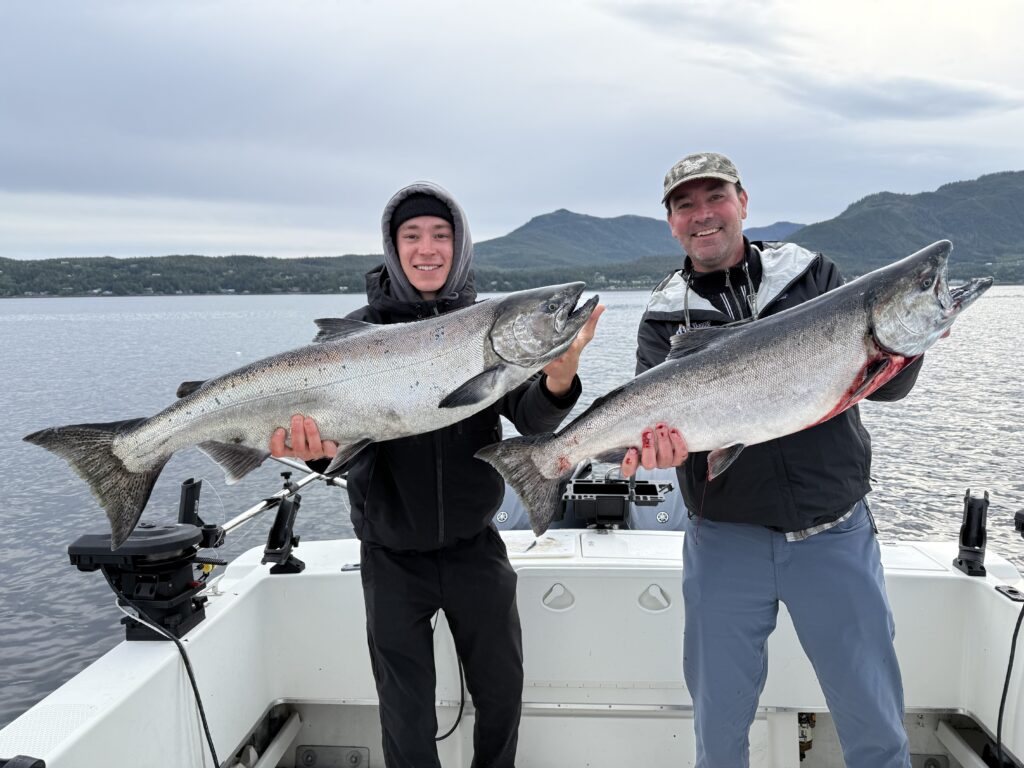 Ketchikan fishing report April photo featuring happy anglers with a spring King Salmon on the 4C's charter boat.