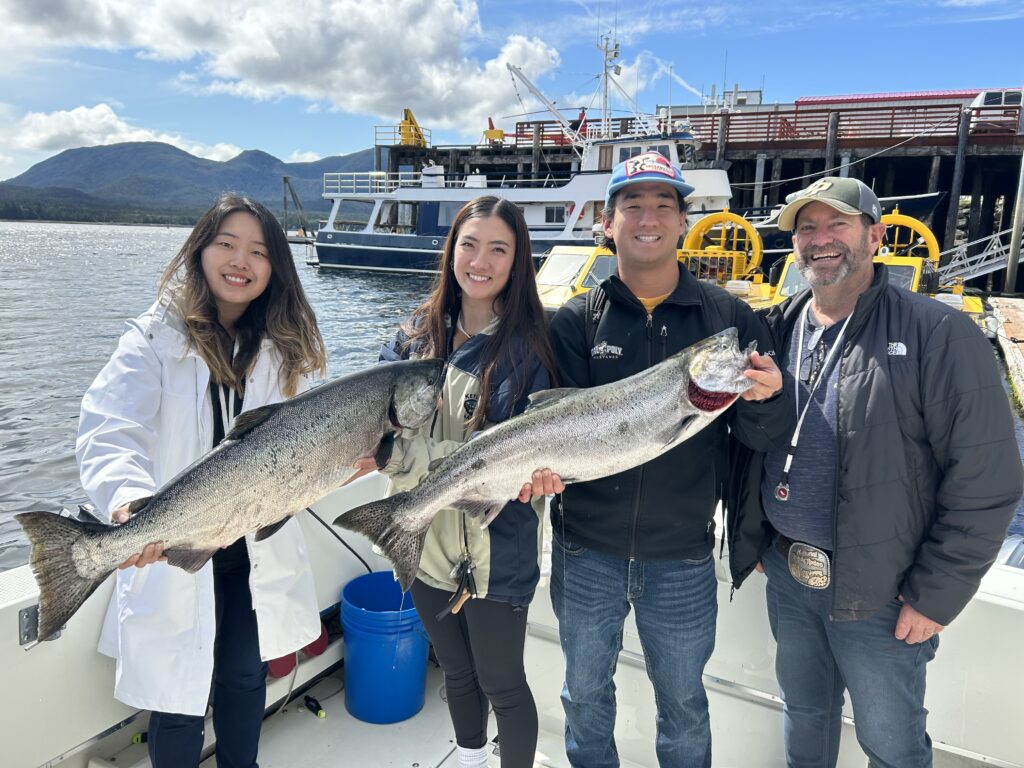 Guest with salmon caught on a 4 hour cruise ship fishing charter in Ketchikan Alaska height=