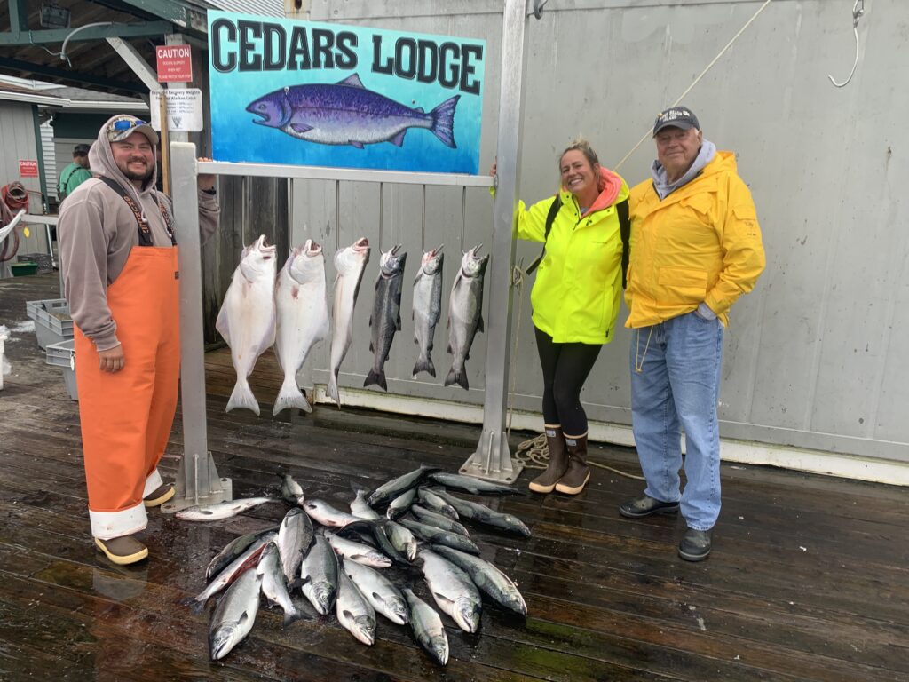 Guest holding king salmon caught on a Ketchikan Alaska fishing charter