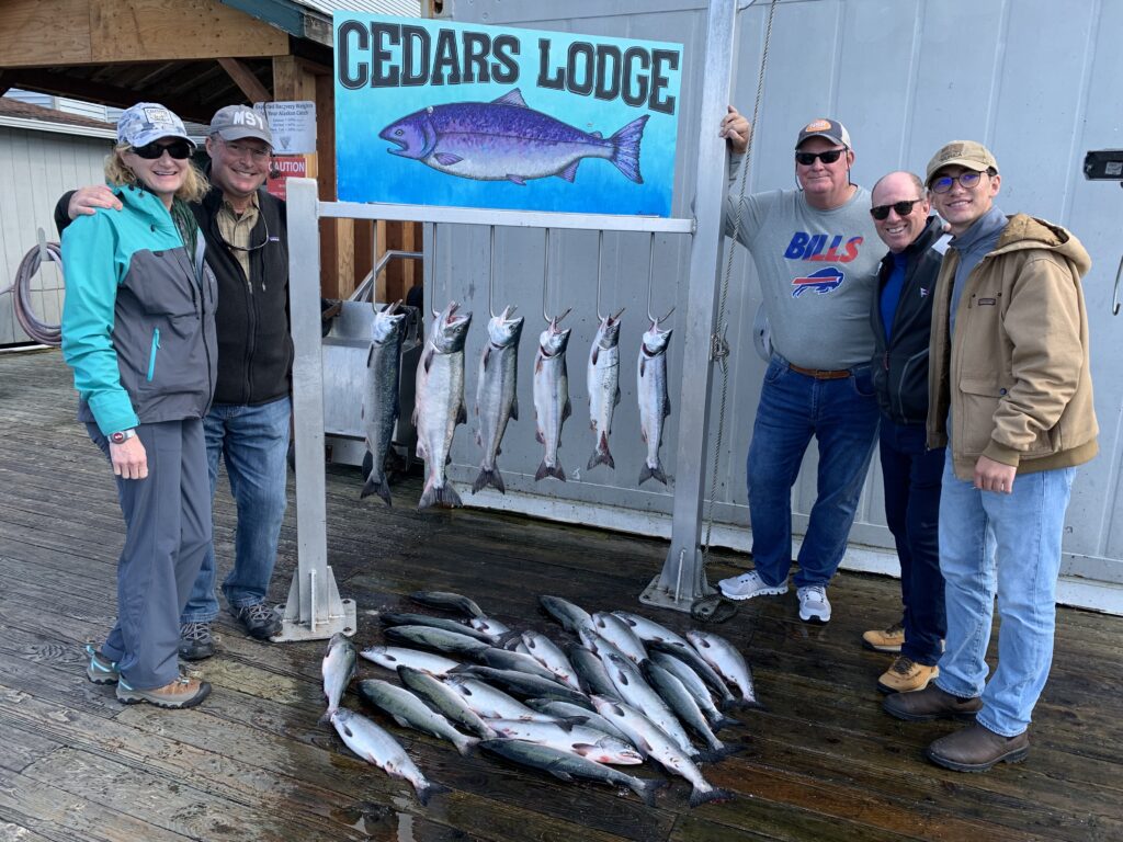 Guest with nice salmon caught on a Ketchikan Alaska fishing charter height=