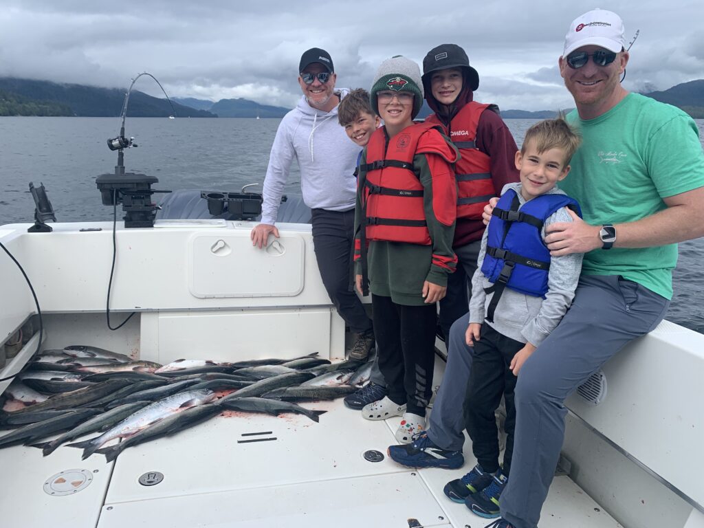 Guest with salmon caught on a 4 hour cruise ship fishing charter in Ketchikan Alaska