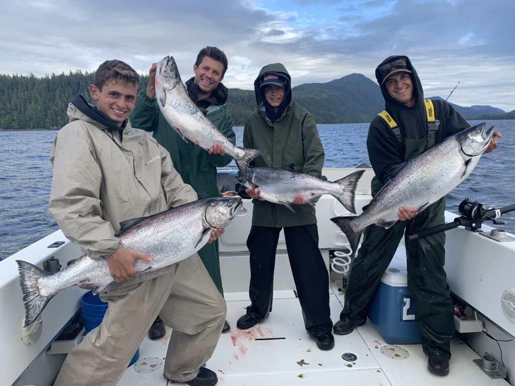 Guest with salmon caught on a 4 hour cruise ship fishing charter in Ketchikan Alaska height=