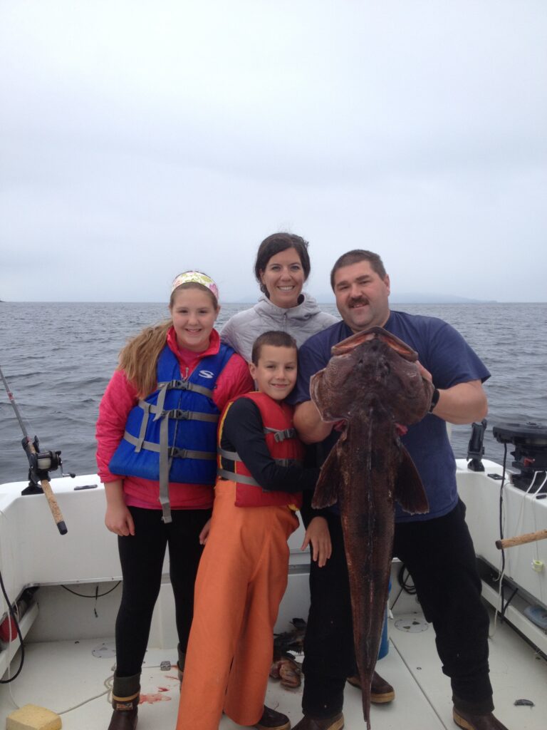 Captain Cable Campbell and family with a Ketchikan Lingcod catch—Campbell’s Fishing Charters.